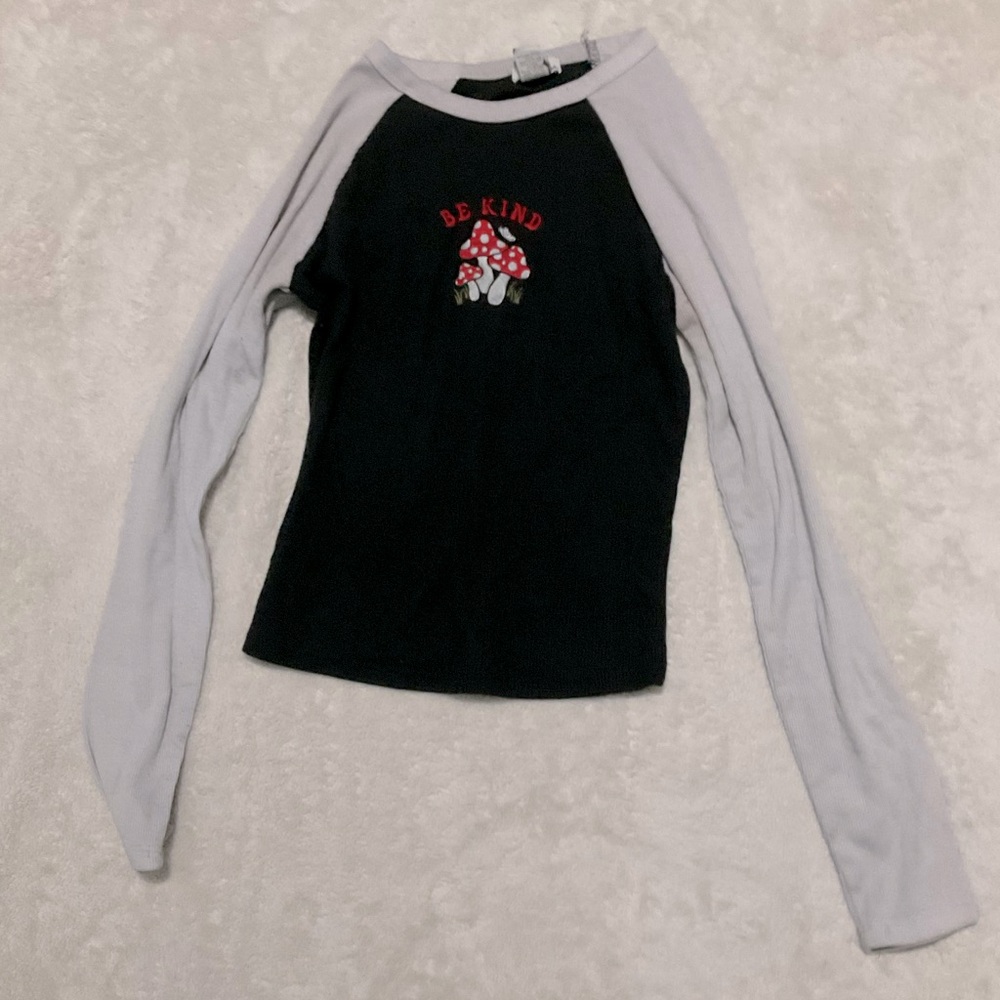 Long sleeve embroidered mushroom tee.